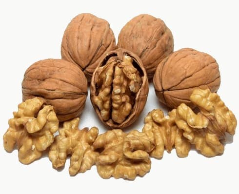 Shelled organic walnuts in a pile